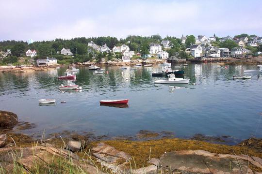 Stongington Maine harbor with fishing vessells and row boats.