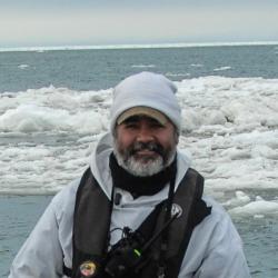 Michael Cameron with sea ice visible behind him
