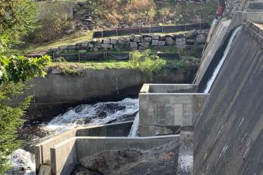 Concrete plunge pool at base of dam